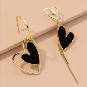 Black and gold heart shaped earrings